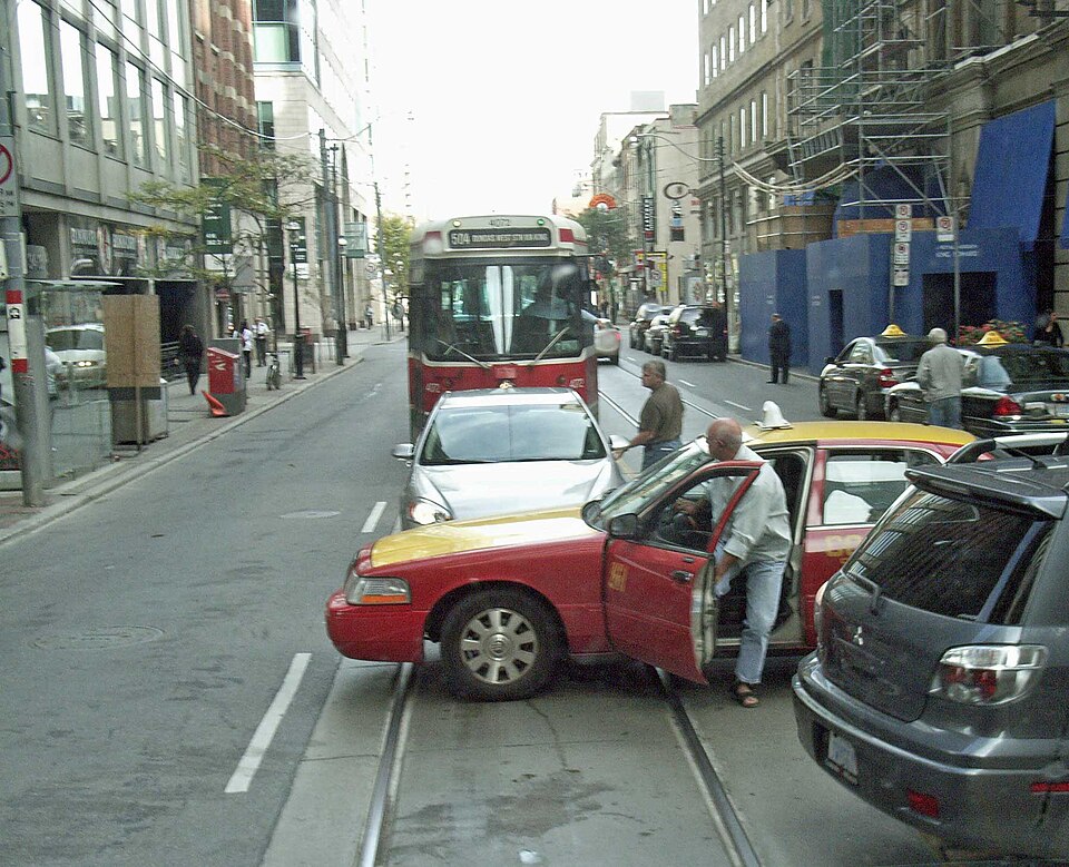 Two drivers emerging from their cars to express anger at a road situation in Toronto, Canada