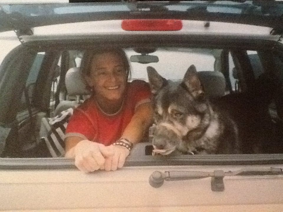 Gabriella Fettucine in her car with dog in tow
