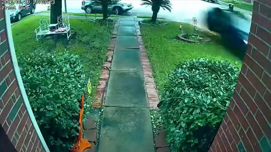 door camera still of Tesla plowing into Texas home killing 76 year old woman